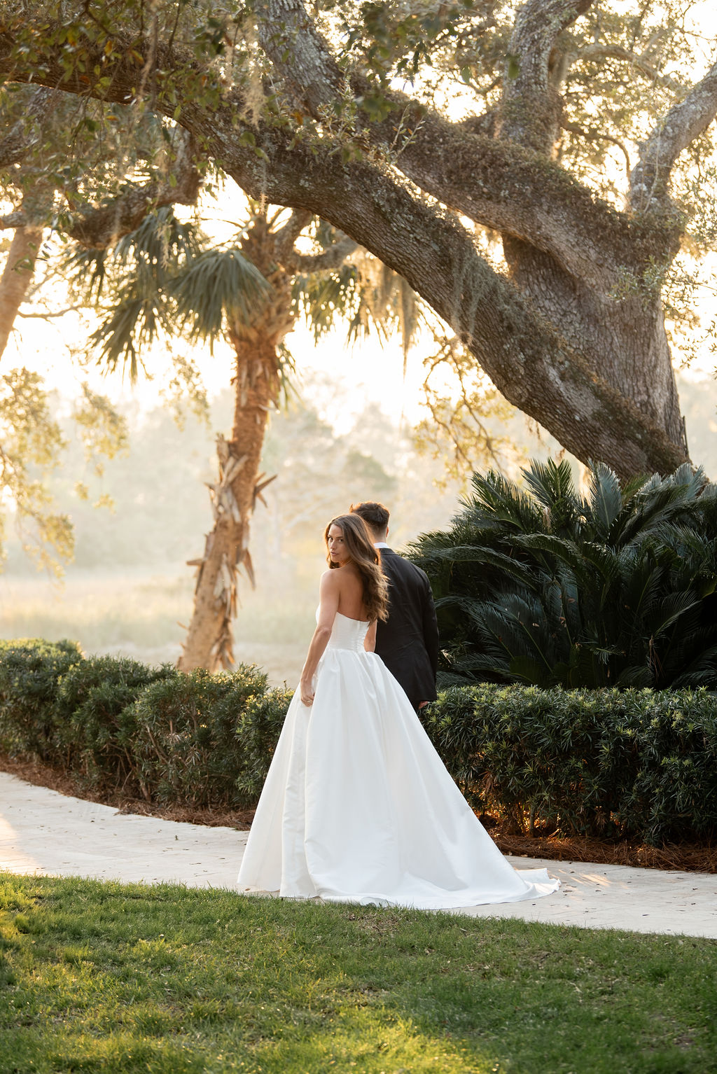 Sea Island bride and groom walking.