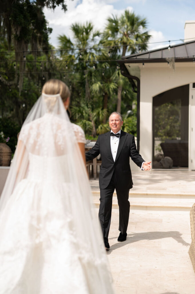A Sea Island bride's first look with her dad.