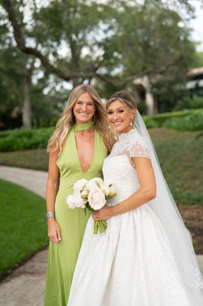 A Sea Island bride with her bridesmaids at the Cloister. The bridesmaids are wearing citrus-inspired, colorful gowns.