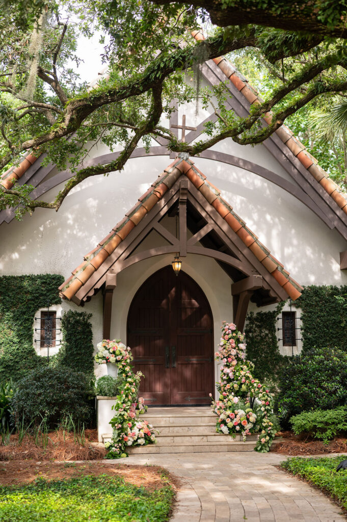 The Cloister Chapel with bright, colorful florals covering the railings.