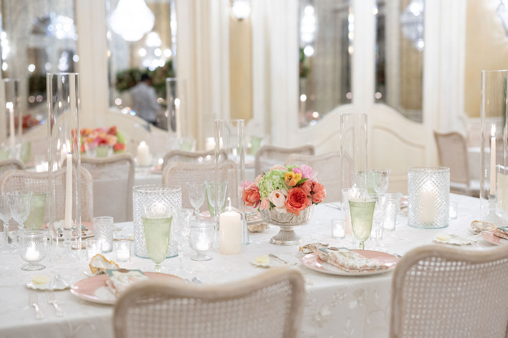 Reception details at a Sea Island wedding reception. Including vibrant florals and colorful place settings.