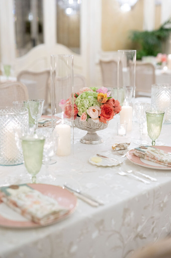 Reception details at a Sea Island wedding reception. Including vibrant florals and colorful place settings.