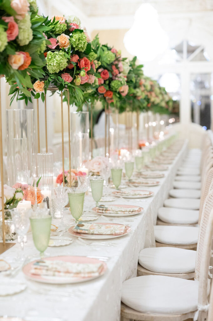 Reception details at a Sea Island wedding reception. Including vibrant florals and colorful place settings.