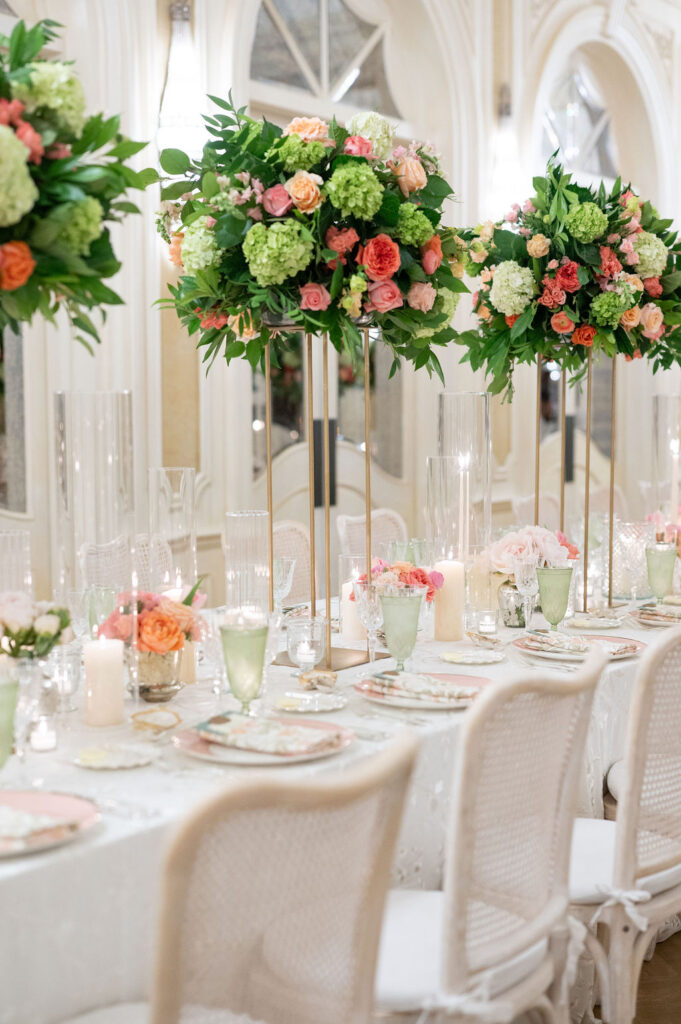 Reception details at a Sea Island wedding reception. Including vibrant florals and colorful place settings.